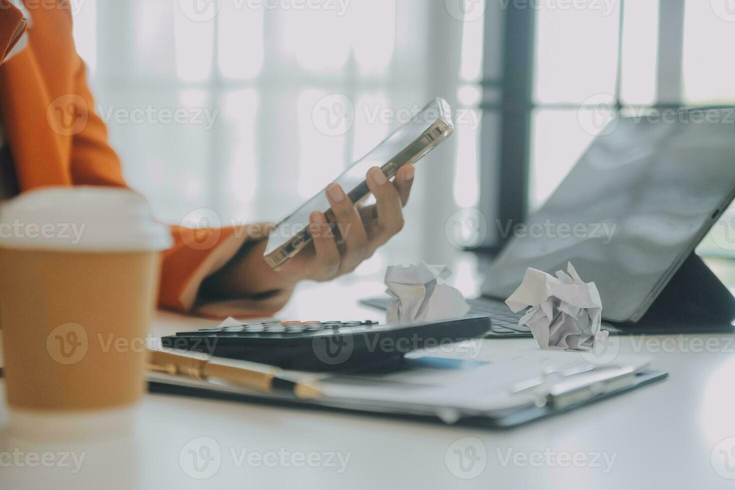 Portrait of tired young business Asian woman work with documents tax laptop computer in office. Sad, unhappy, Worried, Depression, or employee life stress concept photo