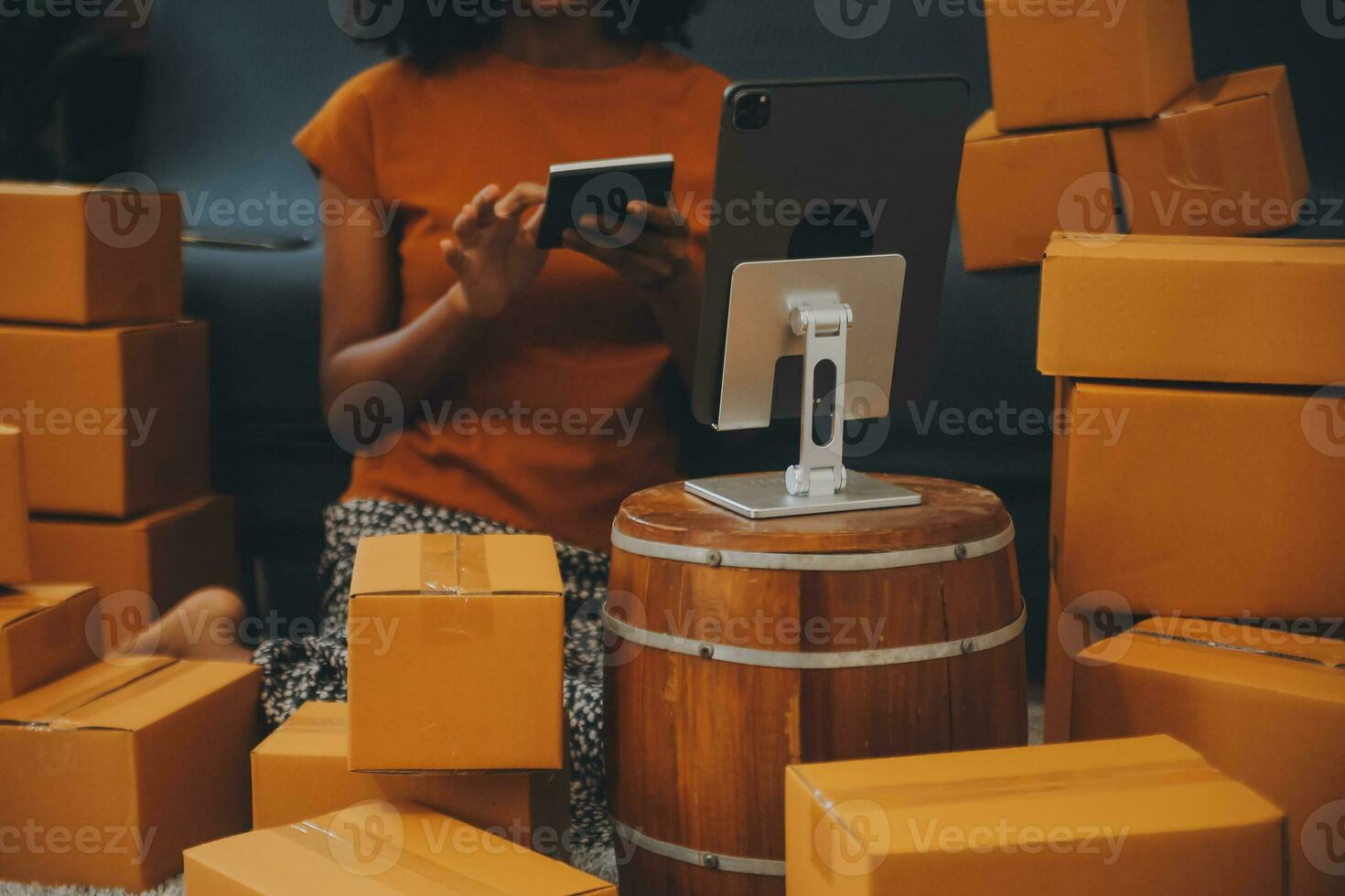 Startup SME small business entrepreneur of freelance Asian woman using a laptop with box Cheerful success happy Asian woman her hand lifts up online marketing packaging and delivery SME idea concept photo