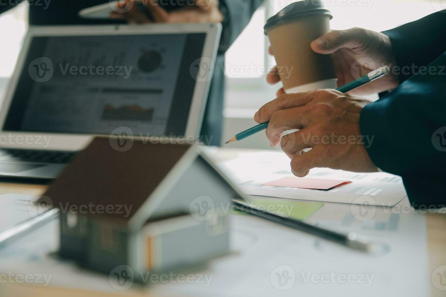 Financial analysts analyze business financial reports on a digital tablet planning investment project during a discussion at a meeting of corporate showing the results of their successful teamwork. photo