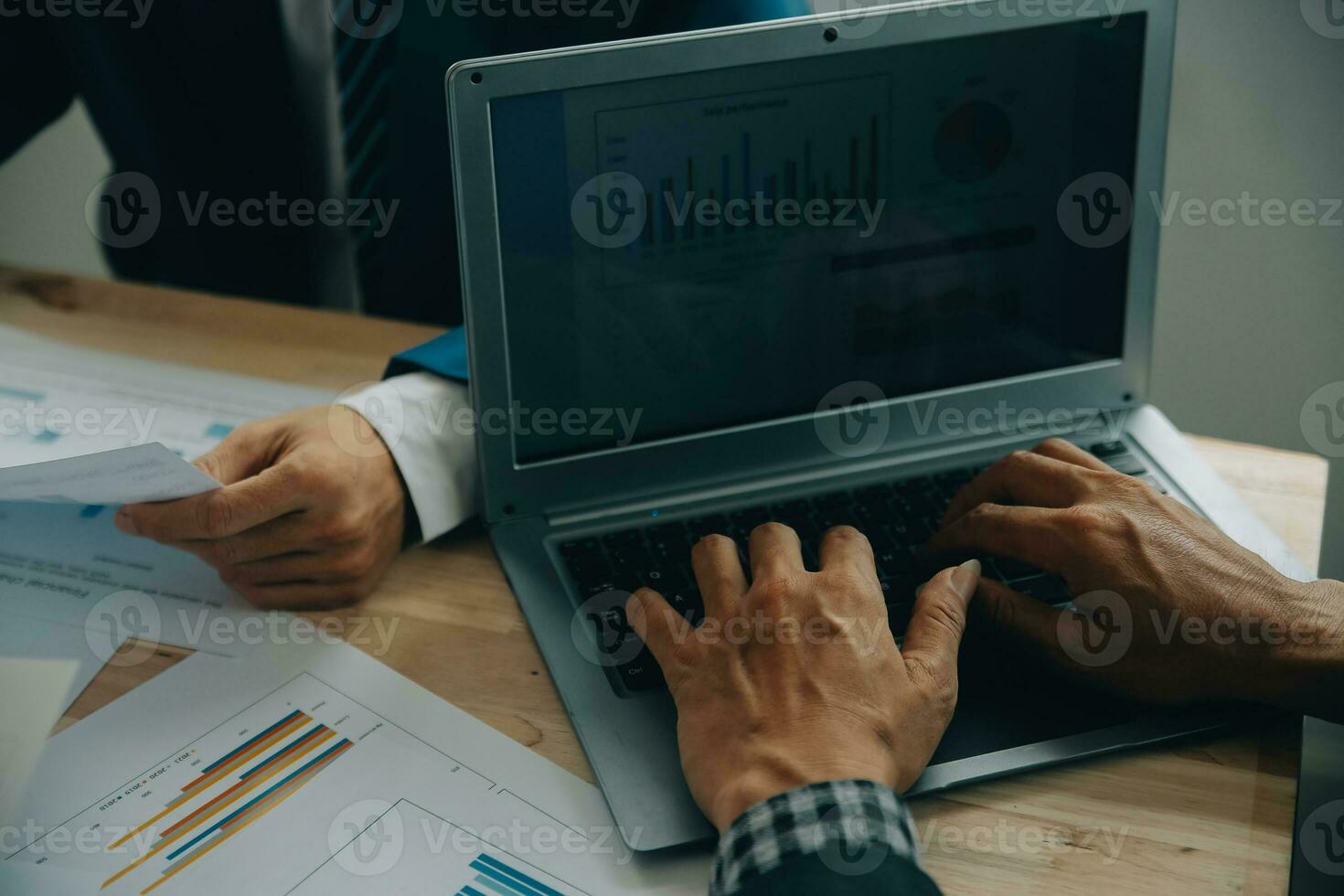 Financial analysts analyze business financial reports on a digital tablet planning investment project during a discussion at a meeting of corporate showing the results of their successful teamwork. photo