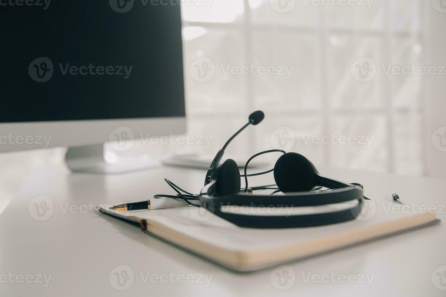 Communication support, call center and customer service help desk. VOIP headset on telephone keyboard. photo