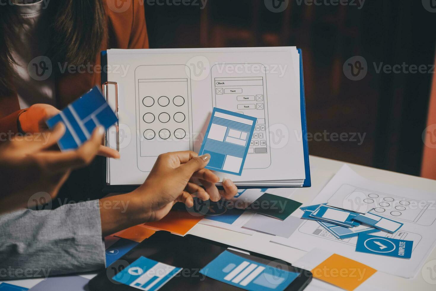 team of UI UX web designer are working together to develop mobile responsive websites. Mobile Mockup photo