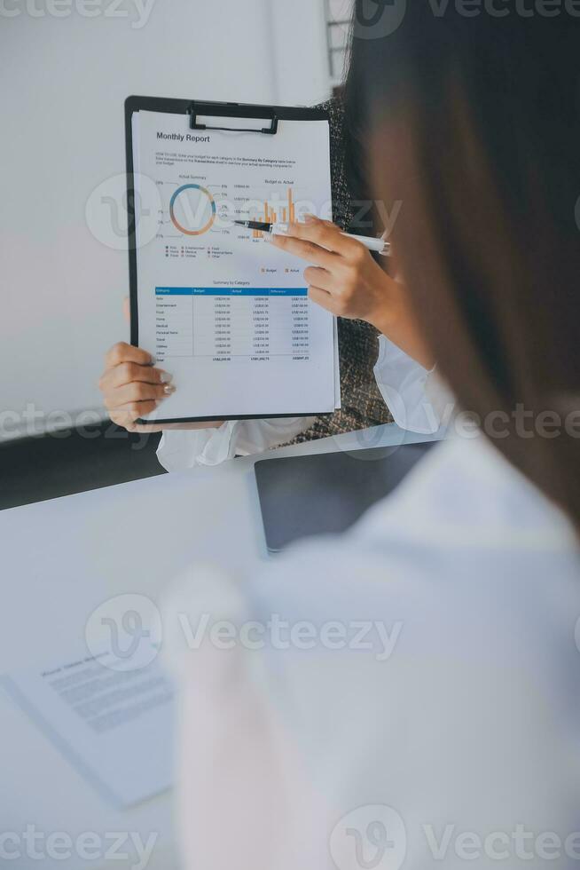 Business team collaboration discussing working analyzing with financial data and marketing growth report graph in team, presentation and brainstorming to strategy planning making profit of company. photo