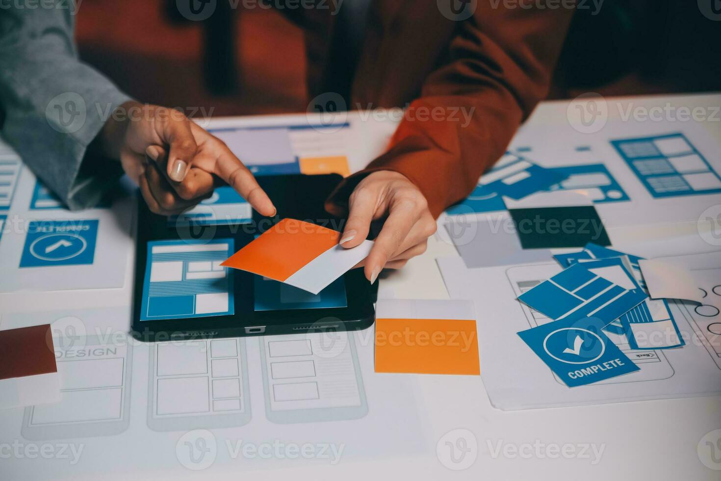 team of UI UX web designer are working together to develop mobile responsive websites. Mobile Mockup photo