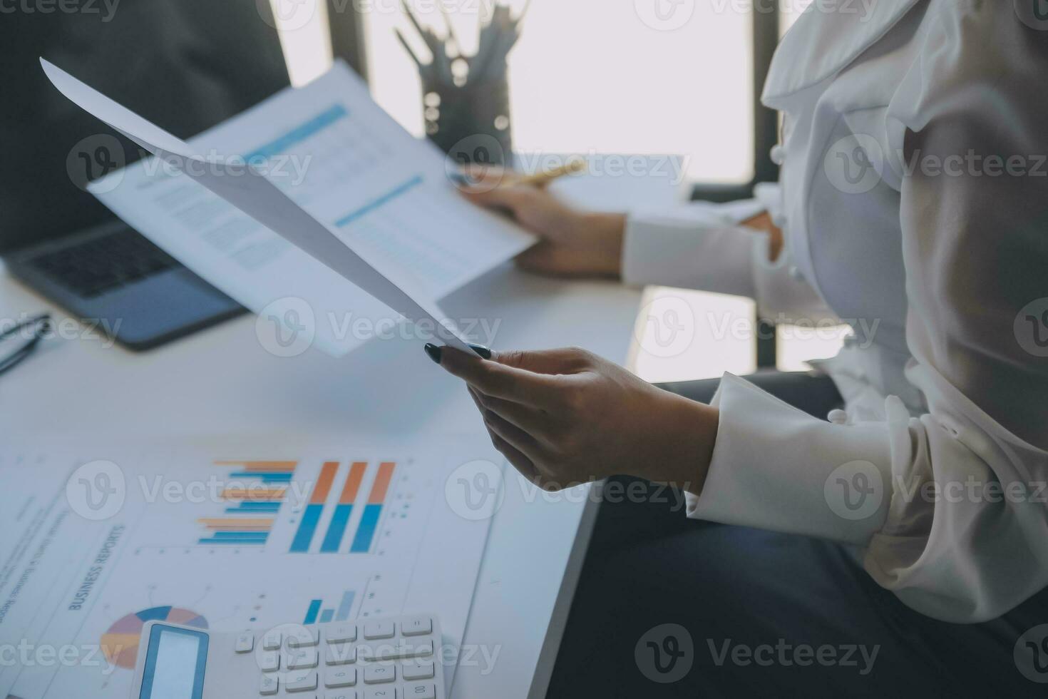 Business team collaboration discussing working analyzing with financial data and marketing growth report graph in team, presentation and brainstorming to strategy planning making profit of company. photo