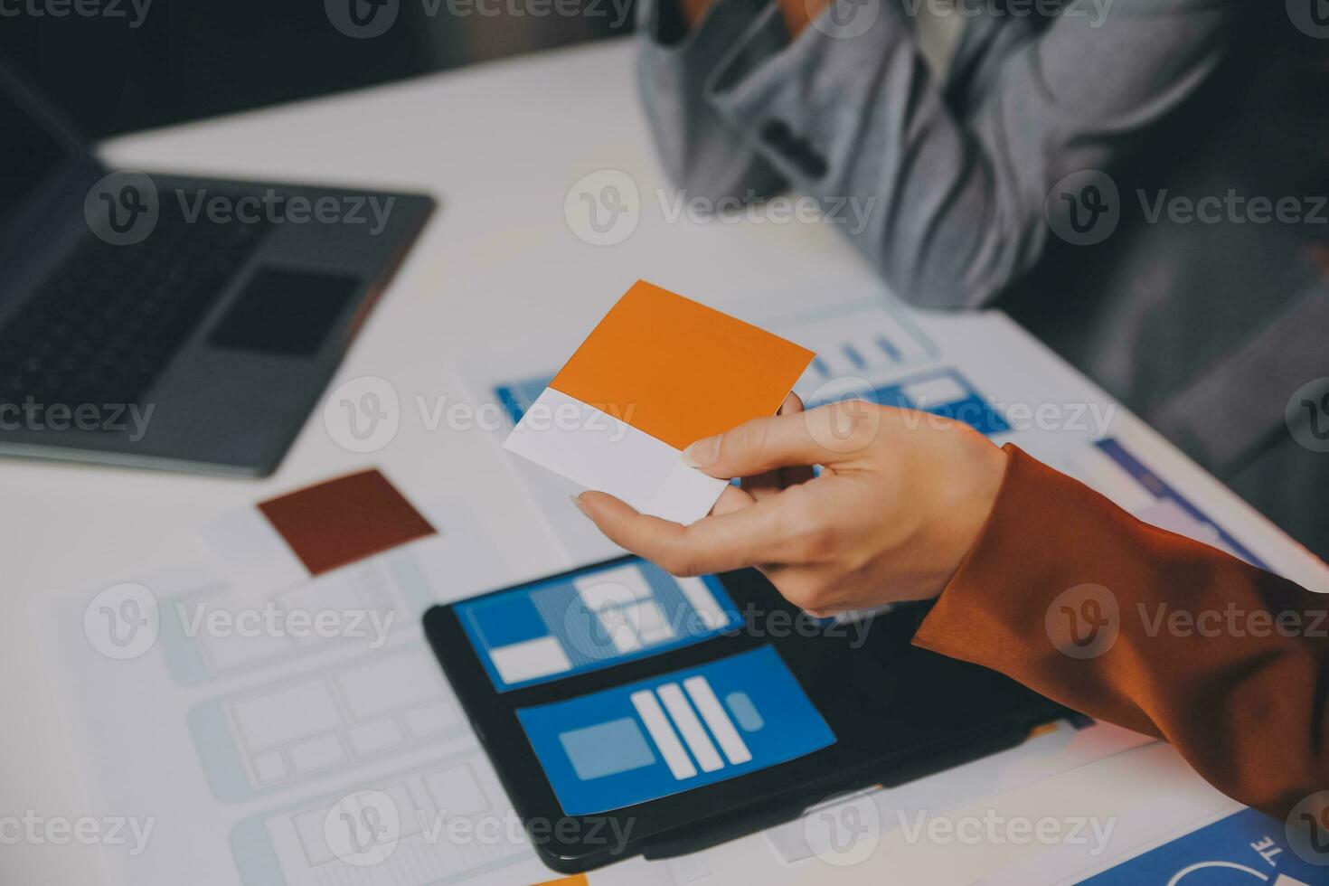 team of UI UX web designer are working together to develop mobile responsive websites. Mobile Mockup photo