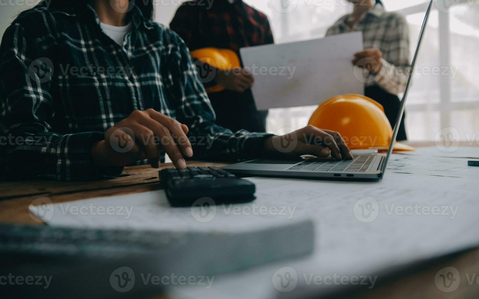 Engineer Teamwork Meeting, Drawing working on blueprint meeting for project working with partner on model building and engineering tools in working site, Construction and structure concept. photo