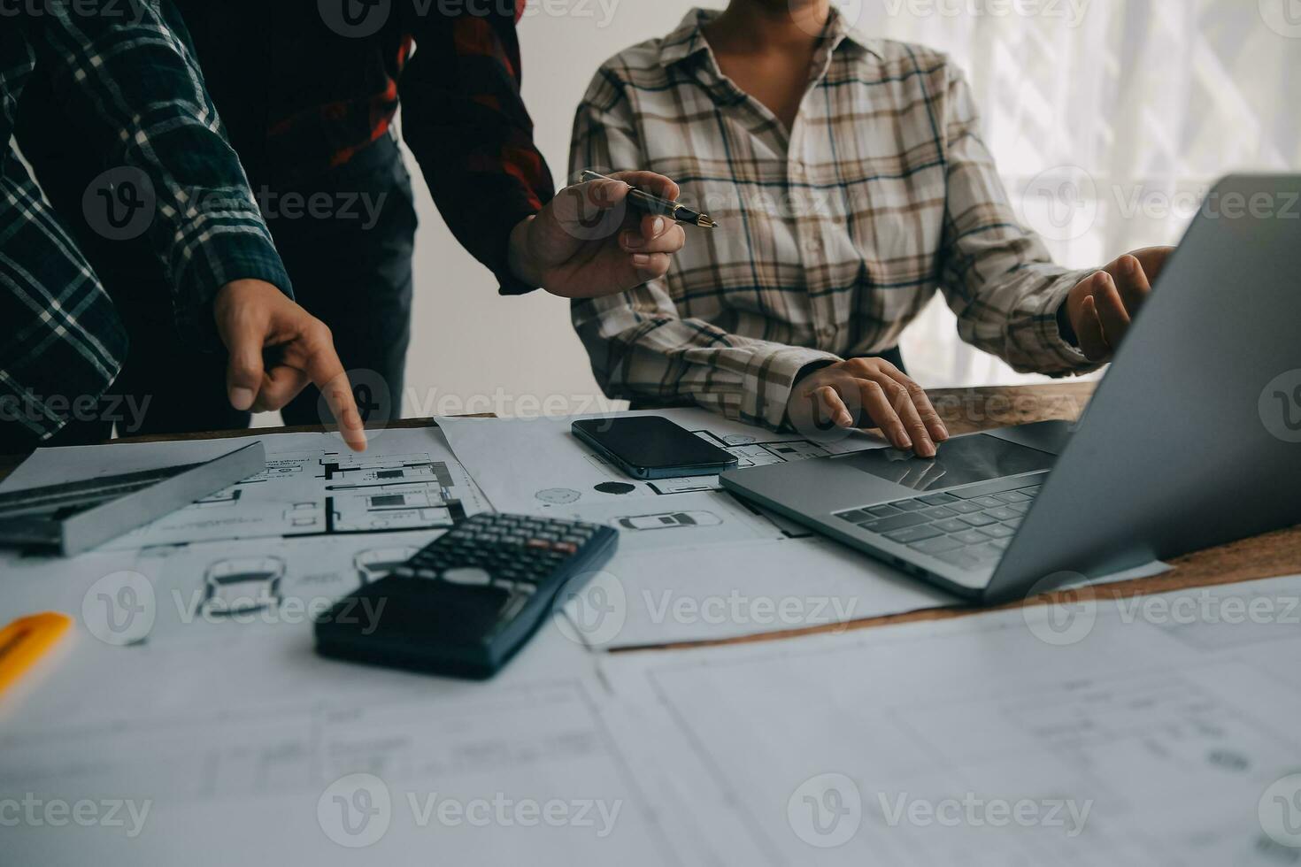 Construction and structure concept of engineer working drawing on blueprint meeting for project working with partner on model building and engineering tools in working site, construction concept. photo