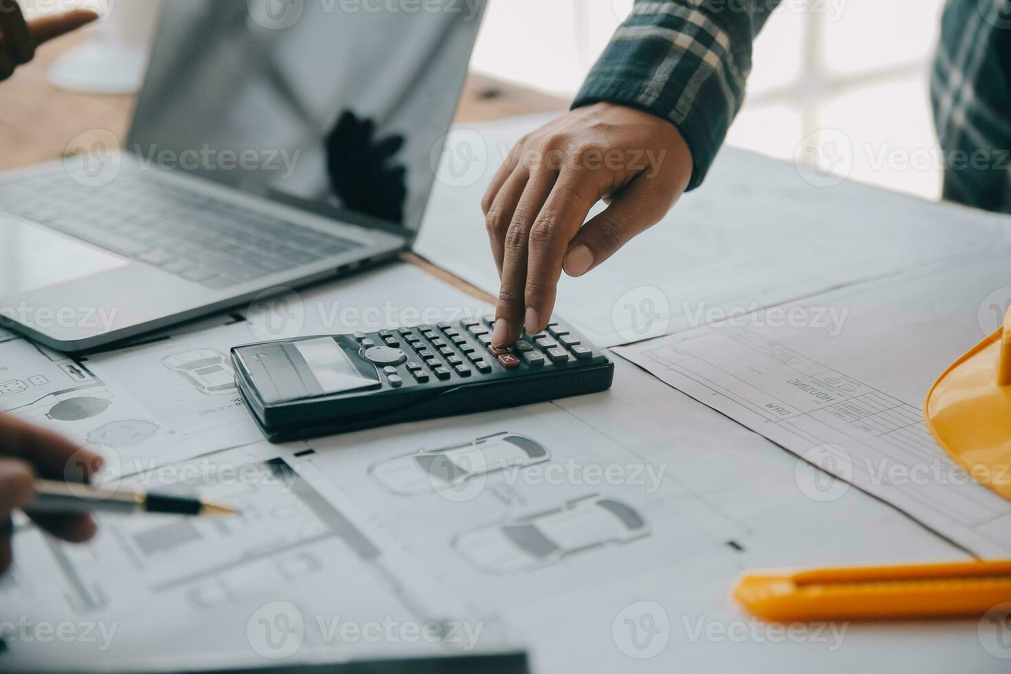 Construction and structure concept of engineer working drawing on blueprint meeting for project working with partner on model building and engineering tools in working site, construction concept. photo