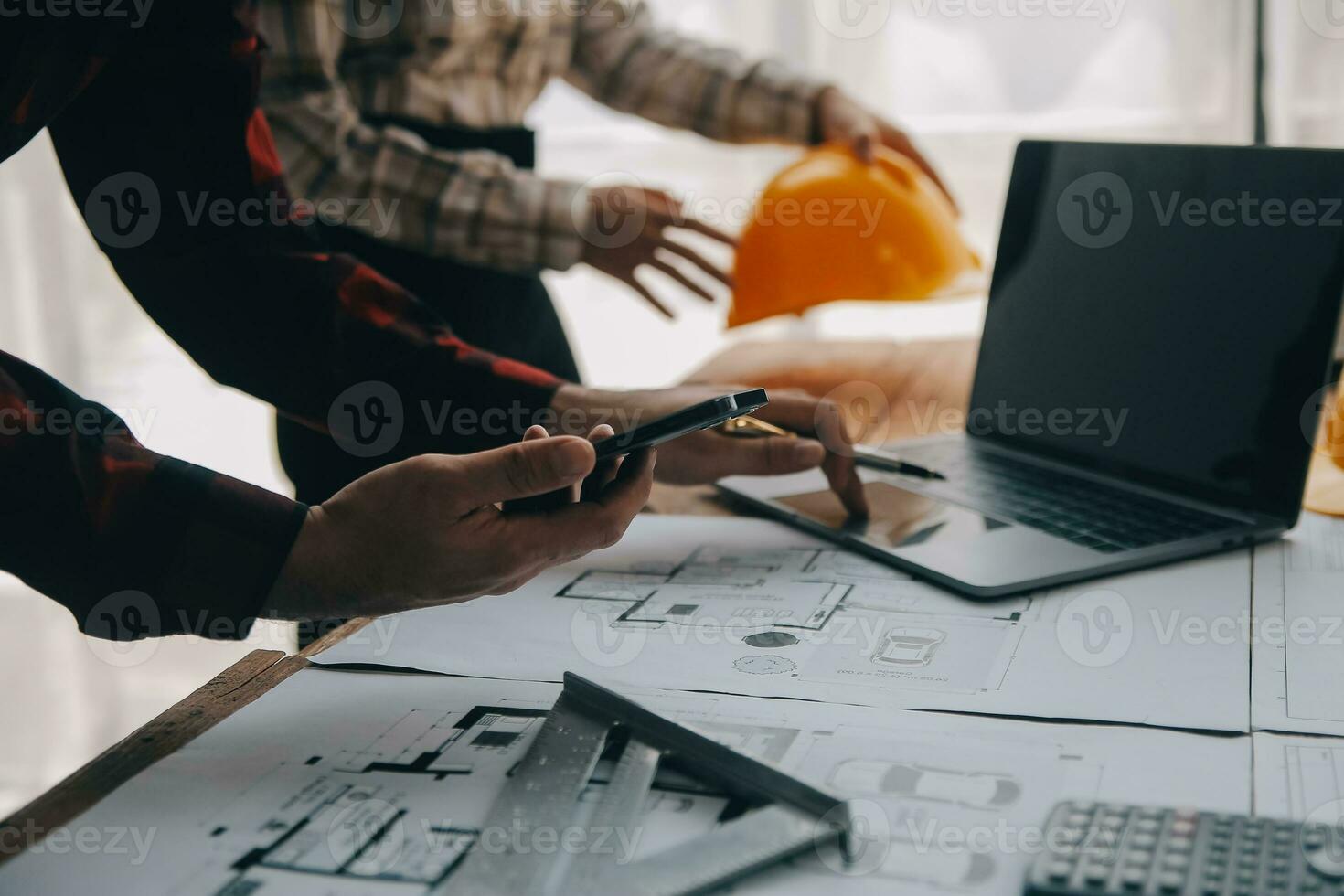 Construction and structure concept of engineer working drawing on blueprint meeting for project working with partner on model building and engineering tools in working site, construction concept. photo