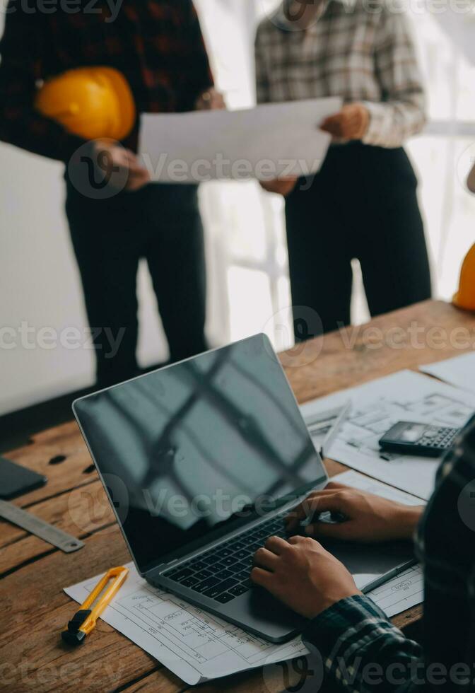 Construction and structure concept of engineer working drawing on blueprint meeting for project working with partner on model building and engineering tools in working site, construction concept. photo