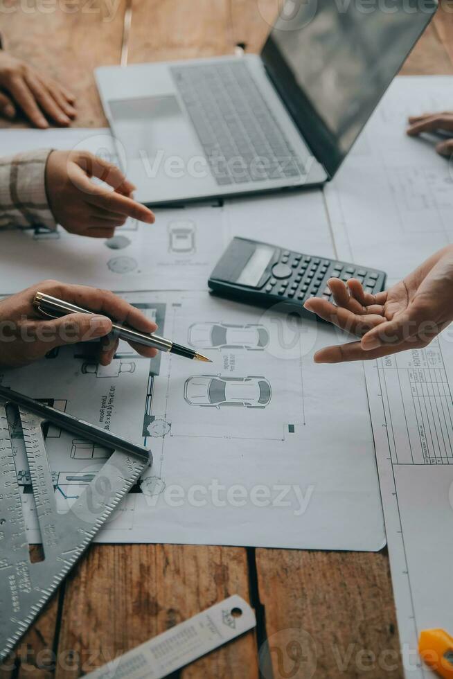Construction and structure concept of engineer working drawing on blueprint meeting for project working with partner on model building and engineering tools in working site, construction concept. photo
