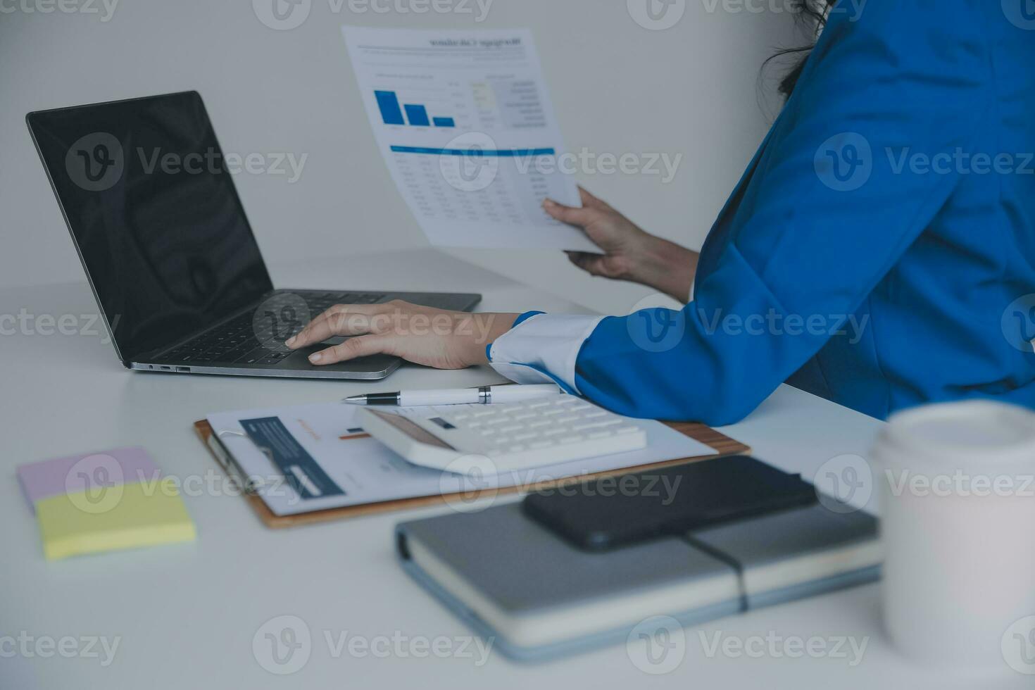 Audit concept,Administrator business man financial inspector and secretary making report calculating balance. Internal Revenue Service checking document. photo