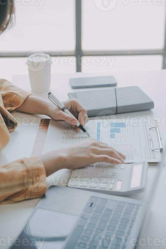 Audit concept,Administrator business man financial inspector and secretary making report calculating balance. Internal Revenue Service checking document. photo