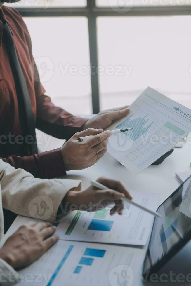 Audit concept,Administrator business man financial inspector and secretary making report calculating balance. Internal Revenue Service checking document. photo