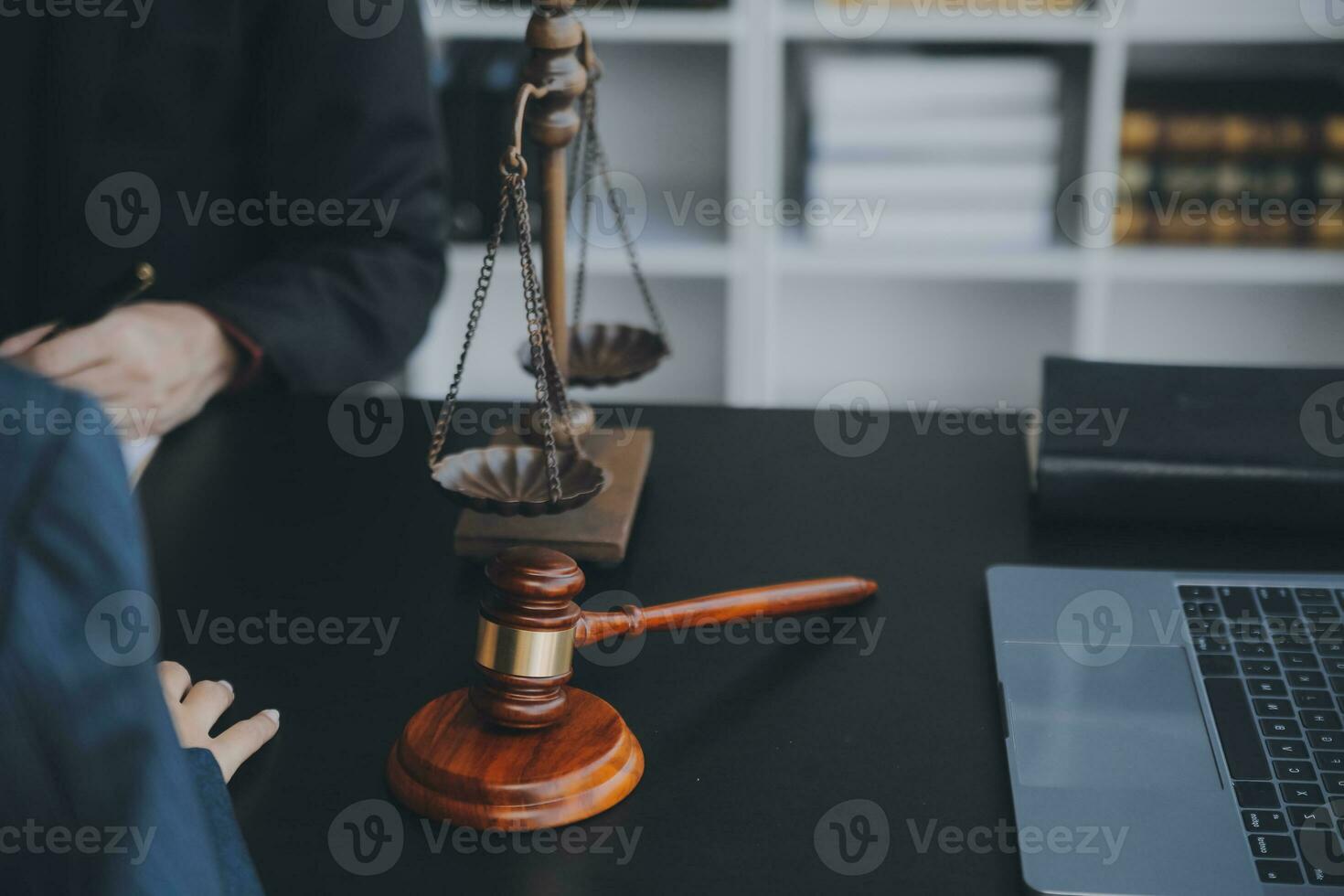 Business and lawyers discussing contract papers with brass scale on desk in office. Law, legal services, advice, justice and law concept picture with film grain effect photo