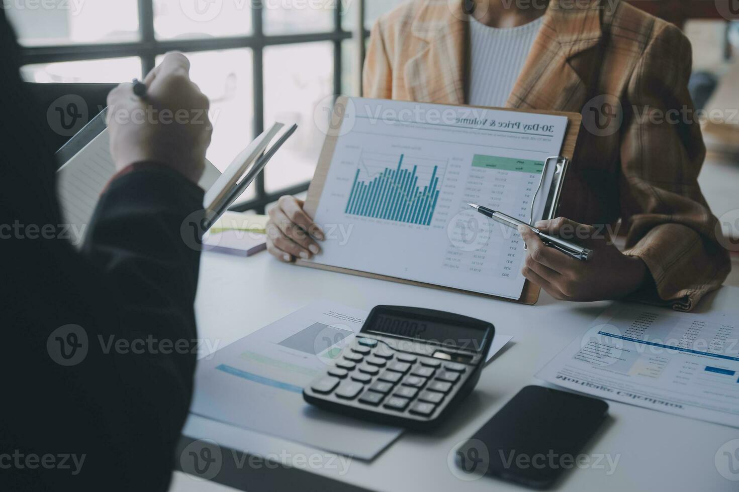 Audit concept,Administrator business man financial inspector and secretary making report calculating balance. Internal Revenue Service checking document. photo