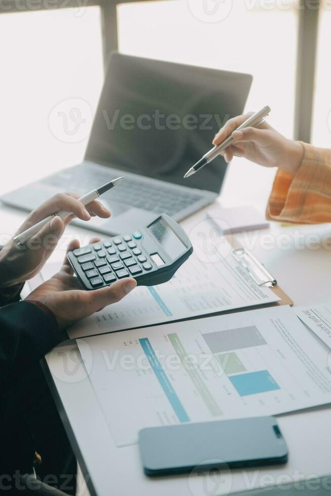 Shot of a asian young business Female working on laptop in her workstation. photo