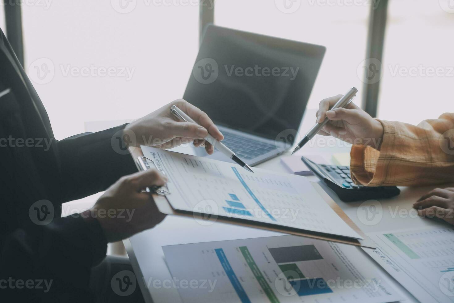 Audit concept,Administrator business man financial inspector and secretary making report calculating balance. Internal Revenue Service checking document. photo