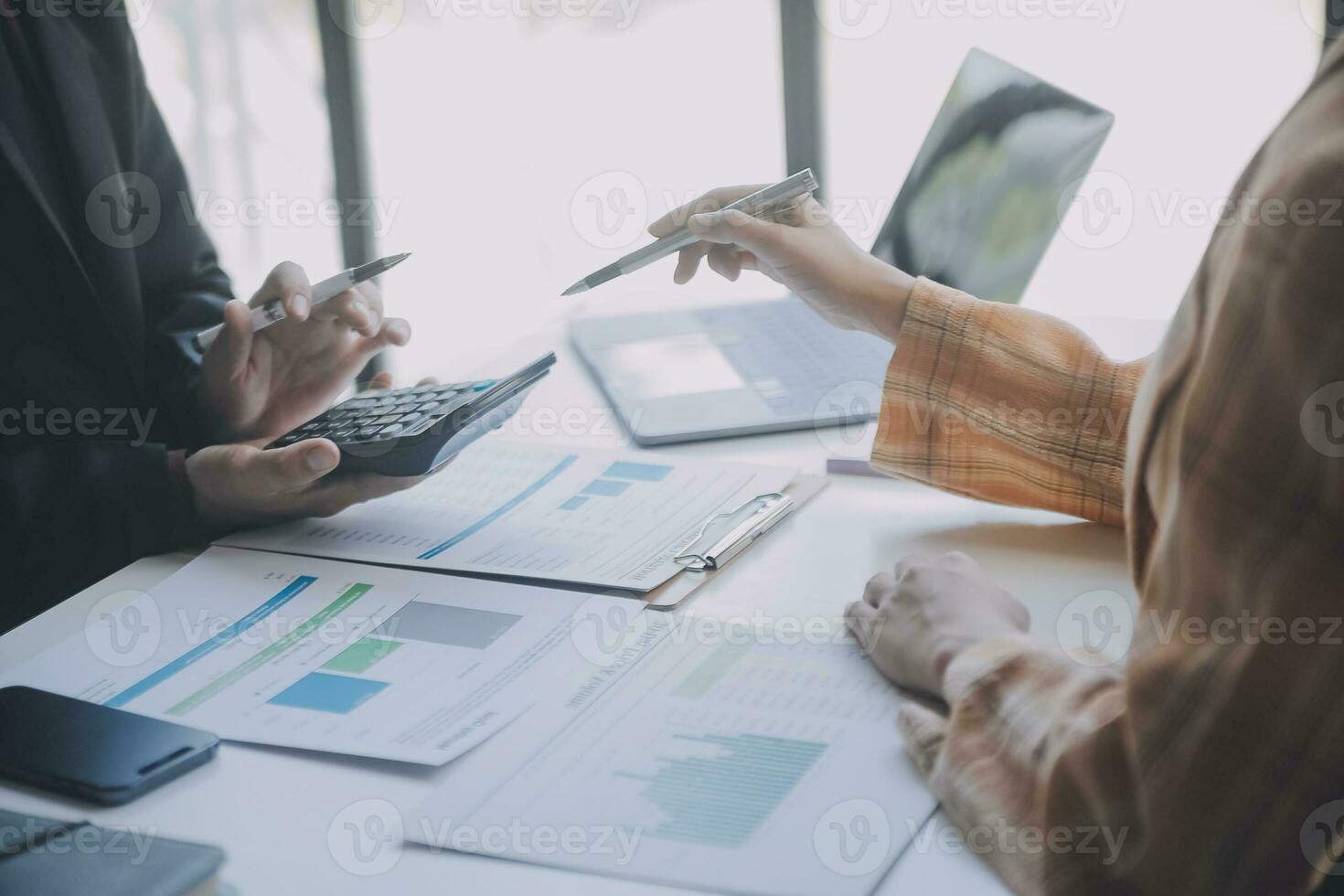Audit concept,Administrator business man financial inspector and secretary making report calculating balance. Internal Revenue Service checking document. photo
