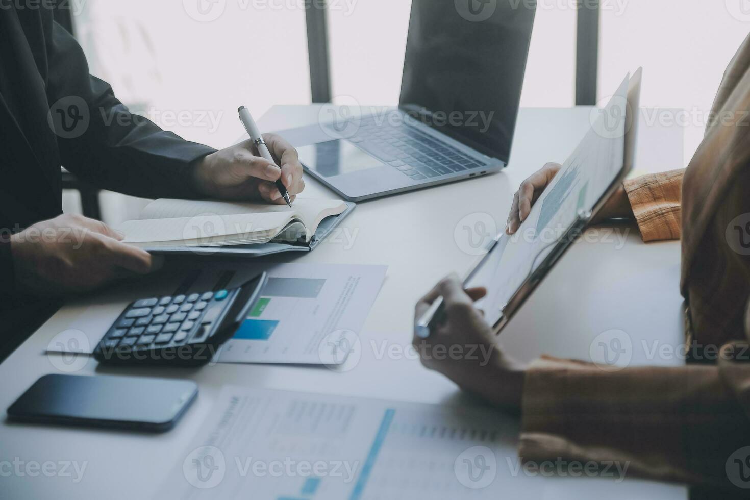 Audit concept,Administrator business man financial inspector and secretary making report calculating balance. Internal Revenue Service checking document. photo