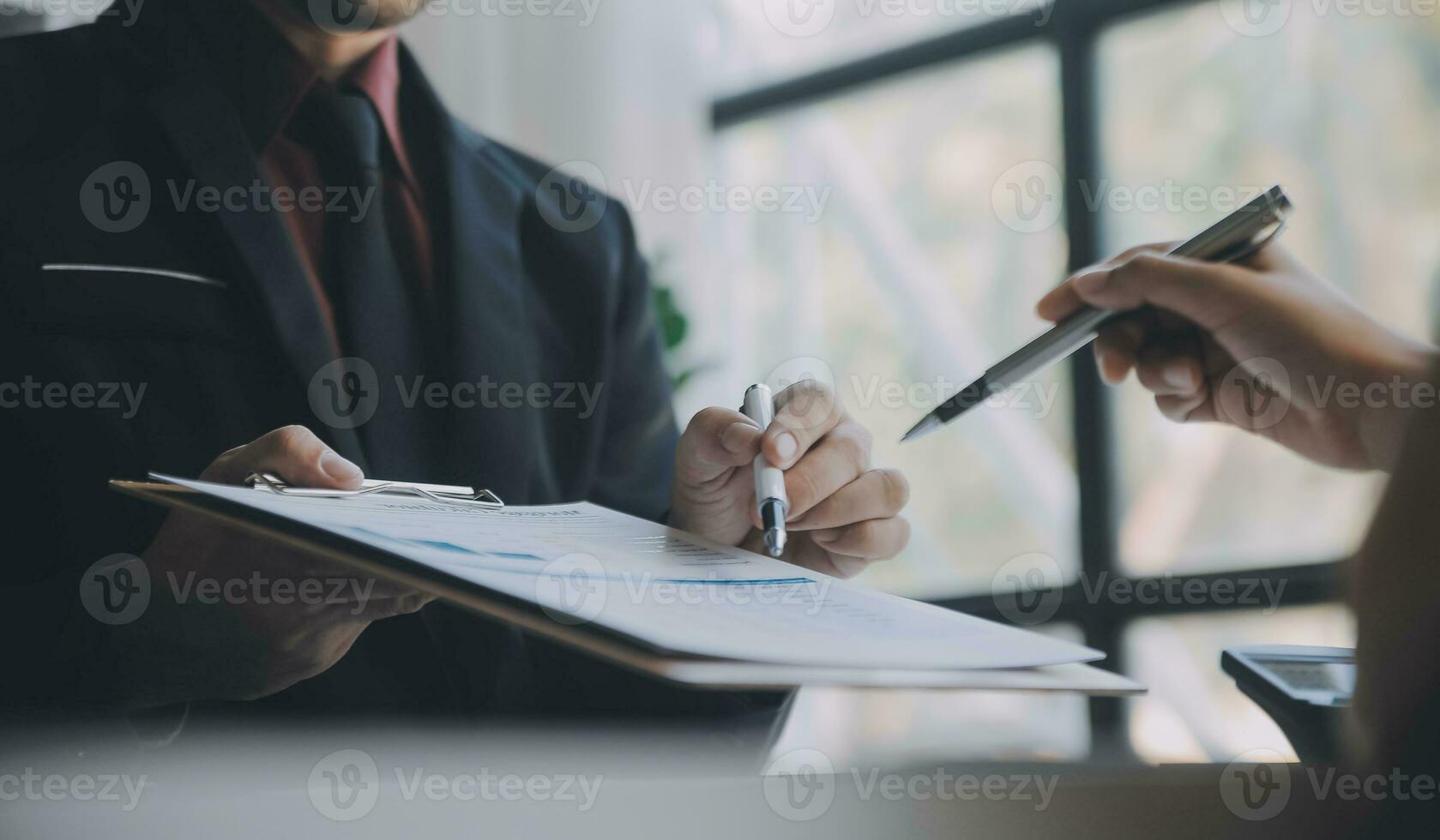 Audit concept,Administrator business man financial inspector and secretary making report calculating balance. Internal Revenue Service checking document. photo