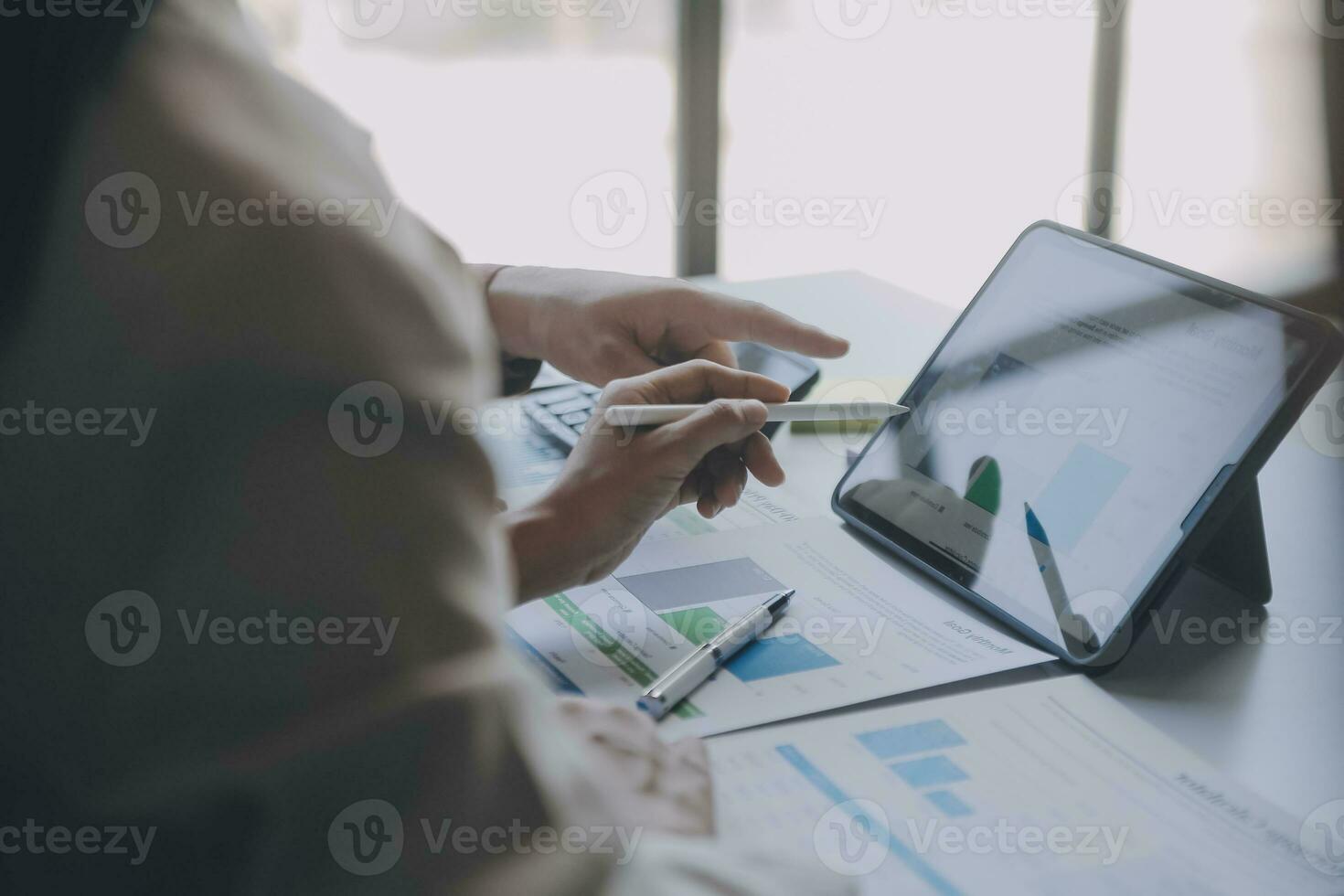 Audit concept,Administrator business man financial inspector and secretary making report calculating balance. Internal Revenue Service checking document. photo