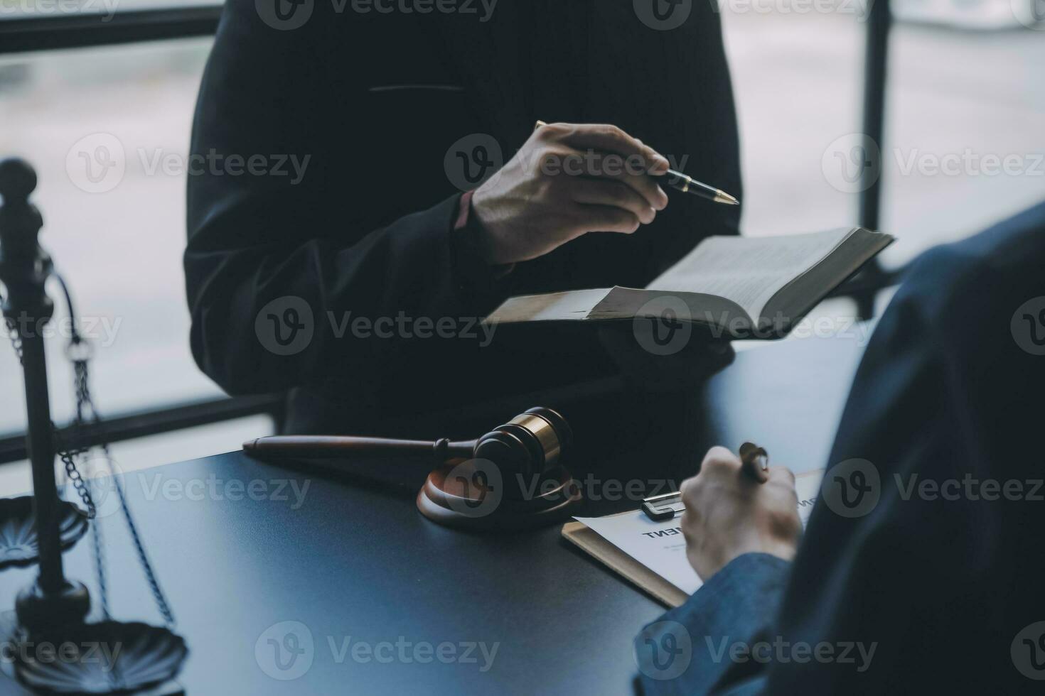 Business and lawyers discussing contract papers with brass scale on desk in office. Law, legal services, advice, justice and law concept picture with film grain effect photo
