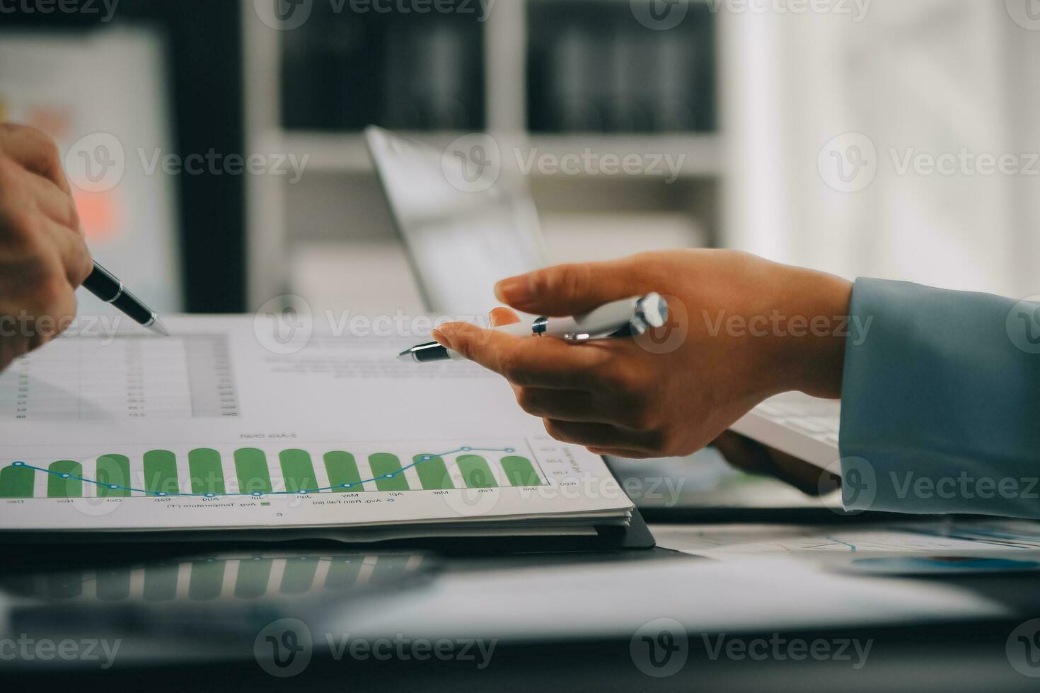 Financial Business team present. Business man hands hold documents with financial statistic stock photo, discussion, and analysis report data the charts and graphs. Finance Financial concept photo