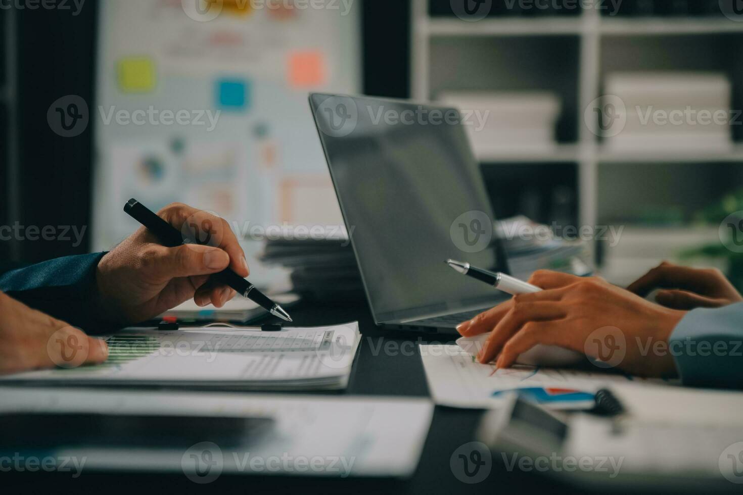 Financial Business team present. Business man hands hold documents with financial statistic stock photo, discussion, and analysis report data the charts and graphs. Finance Financial concept photo