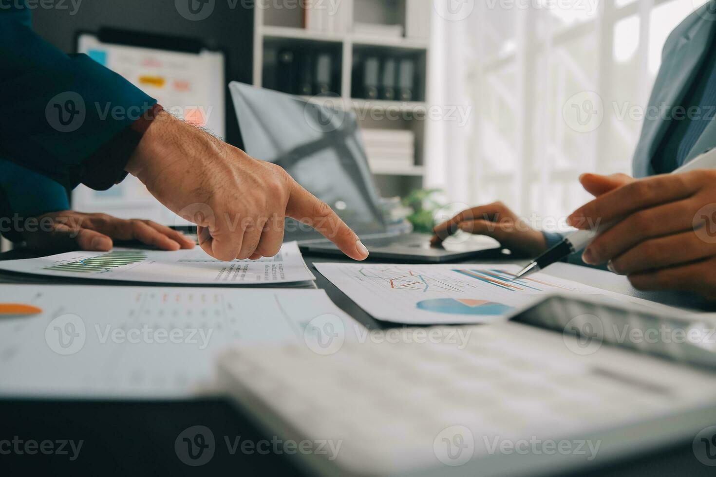 Financial Business team present. Business man hands hold documents with financial statistic stock photo, discussion, and analysis report data the charts and graphs. Finance Financial concept photo