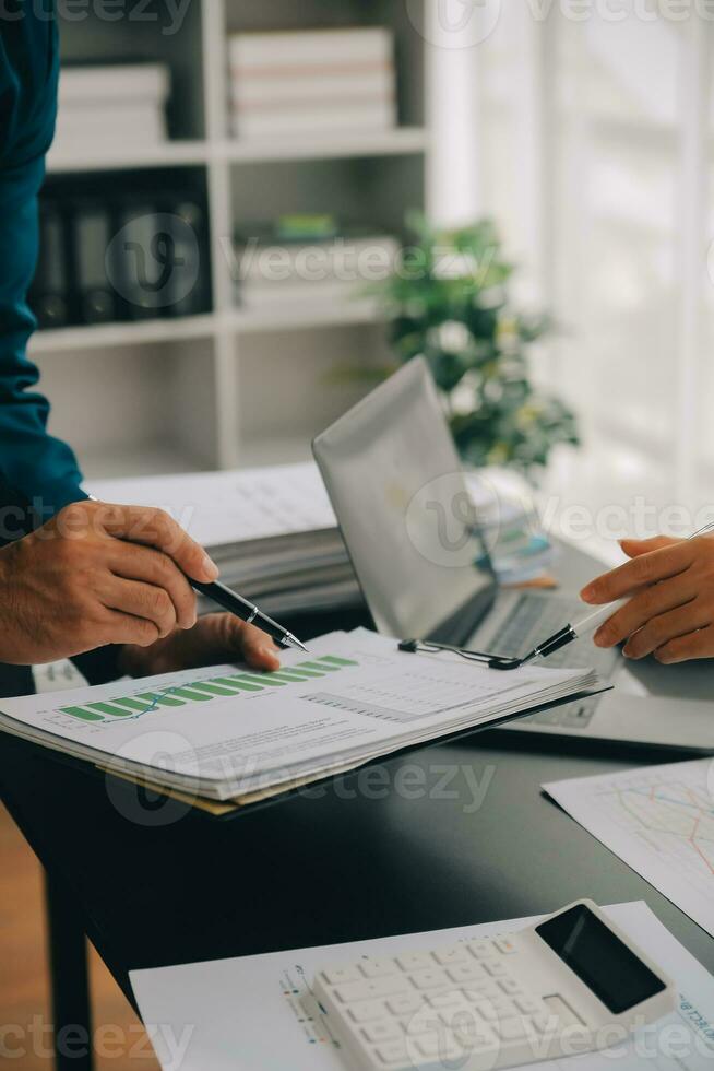 Financial Business team present. Business man hands hold documents with financial statistic stock photo, discussion, and analysis report data the charts and graphs. Finance Financial concept photo