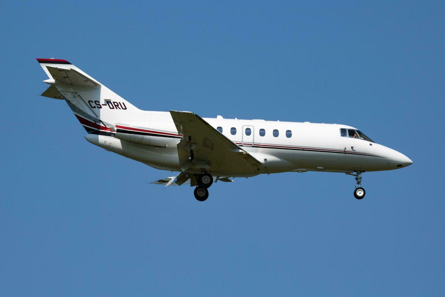 Vienna, Austria, 2018 - NetJets Europe Raytheon Hawker 800XP CS-DRU passenger plane arrival and landing at Vienna Airport photo