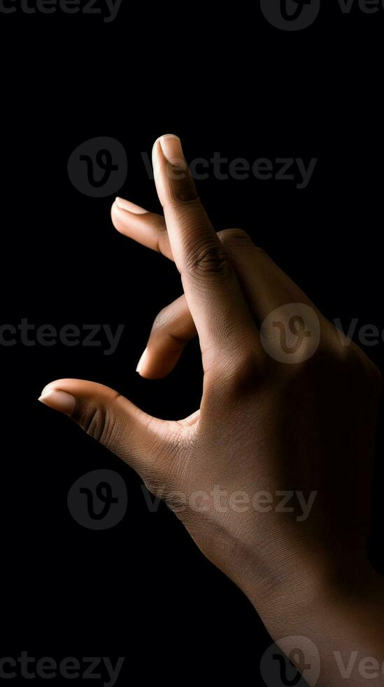 AI Generated the hand of an Aufro-Americans on a black background in a beam of light photo