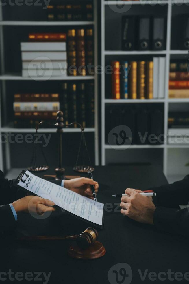 female lawyers working at the law firms. Judge gavel with scales of justice. Legal law, lawyer, advice and justice concept. photo