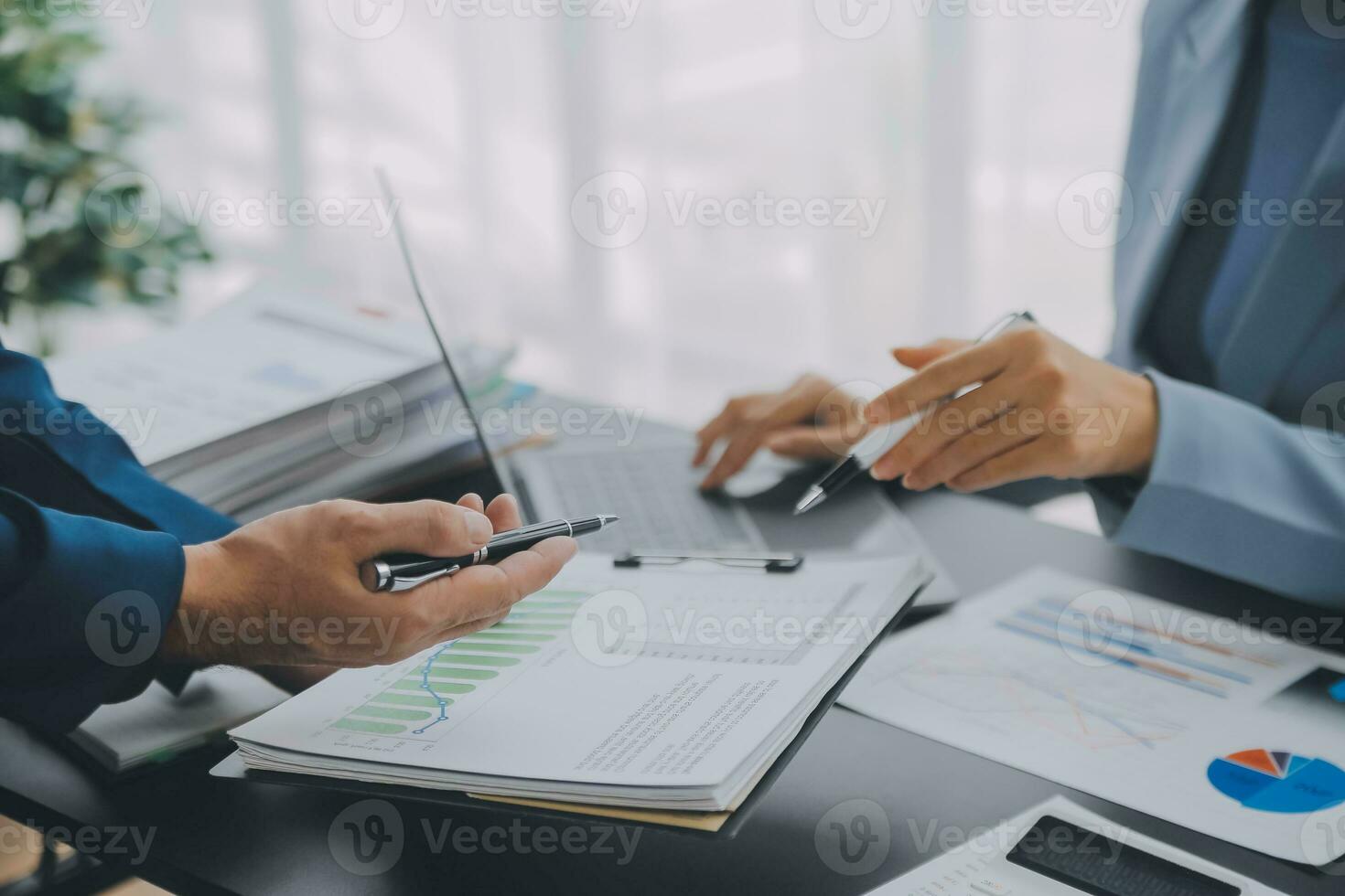 Financial Business team present. Business man hands hold documents with financial statistic stock photo, discussion, and analysis report data the charts and graphs. Finance Financial concept photo