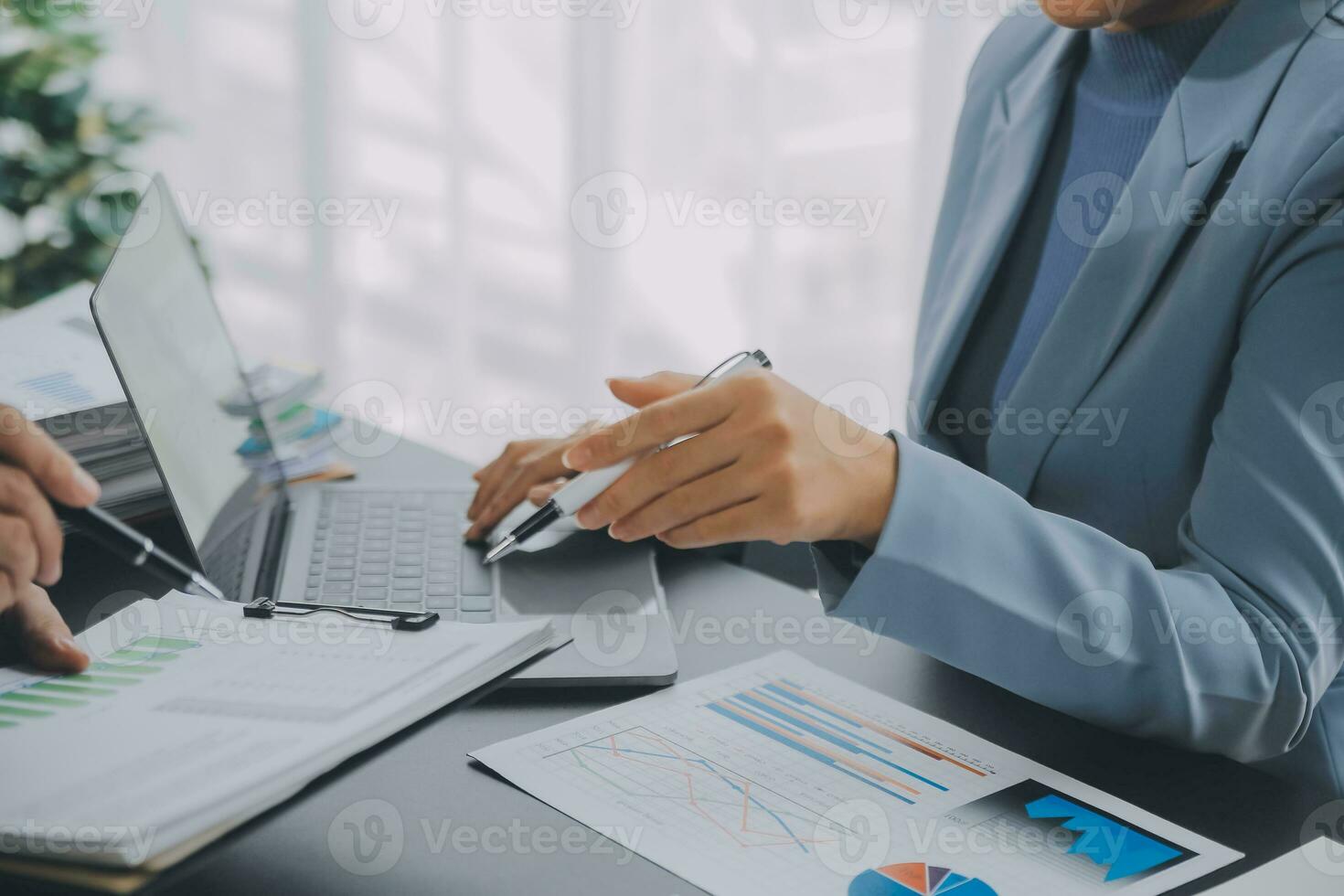 Financial Business team present. Business man hands hold documents with financial statistic stock photo, discussion, and analysis report data the charts and graphs. Finance Financial concept photo