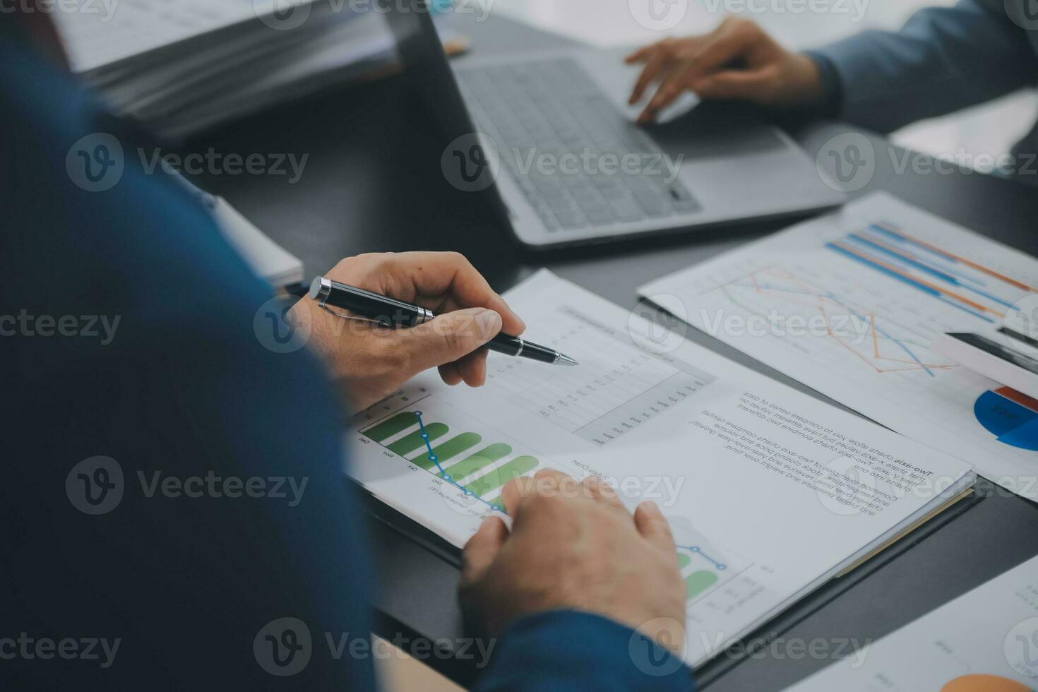 Financial Business team present. Business man hands hold documents with financial statistic stock photo, discussion, and analysis report data the charts and graphs. Finance Financial concept photo