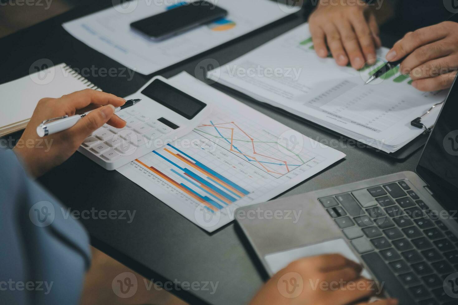 Financial Business team present. Business man hands hold documents with financial statistic stock photo, discussion, and analysis report data the charts and graphs. Finance Financial concept photo