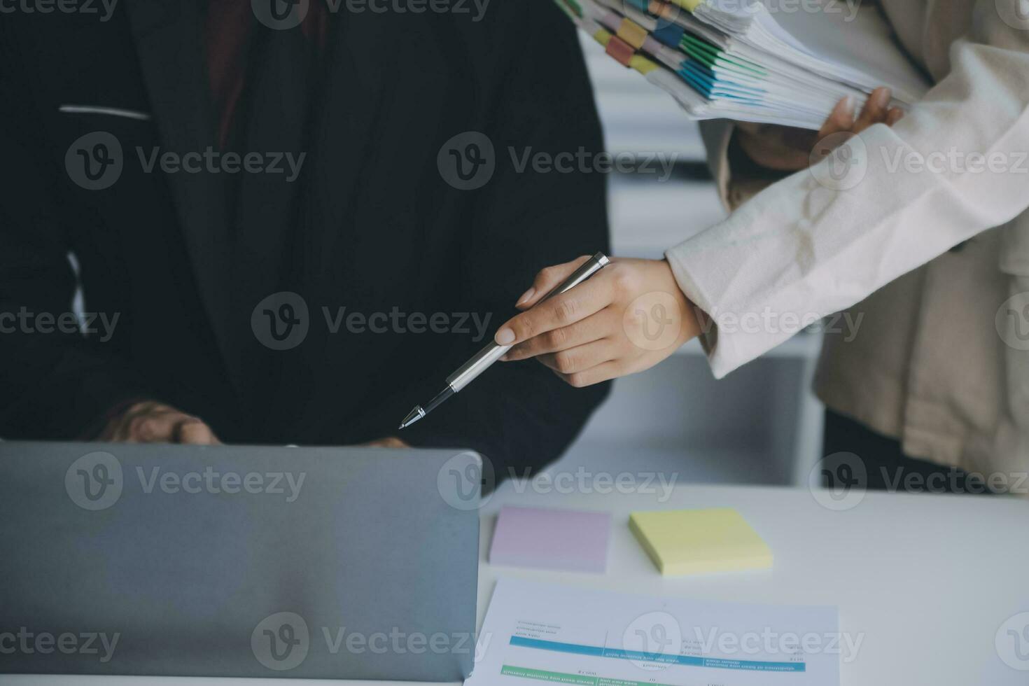 Financial analysts analyze business financial reports on a digital tablet planning investment project during a discussion at a meeting of corporate showing the results of their successful teamwork. photo