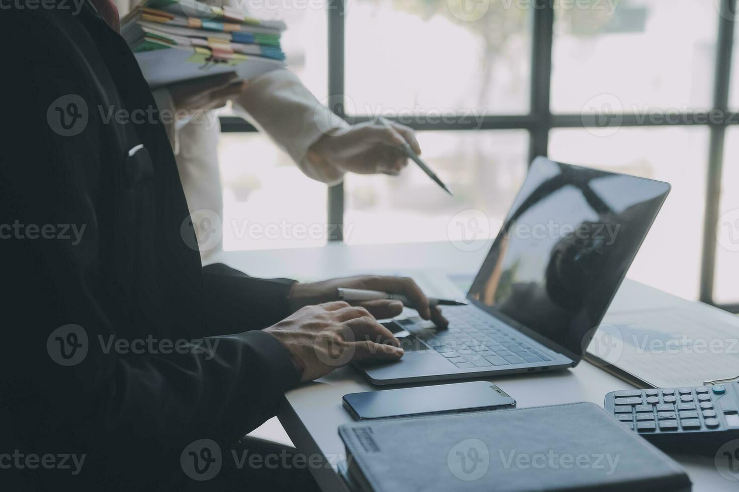Financial analysts analyze business financial reports on a digital tablet planning investment project during a discussion at a meeting of corporate showing the results of their successful teamwork. photo