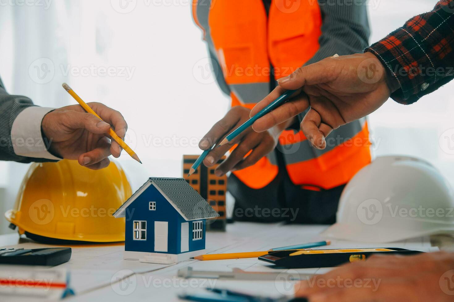 Construction and structure concept of Engineer or architect meeting for project working with partner and engineering tools on model building and blueprint in working site, contract for both companies. photo