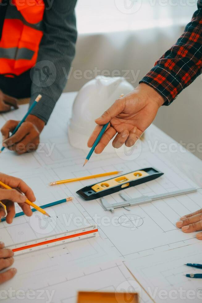 Construction and structure concept of Engineer or architect meeting for project working with partner and engineering tools on model building and blueprint in working site, contract for both companies. photo