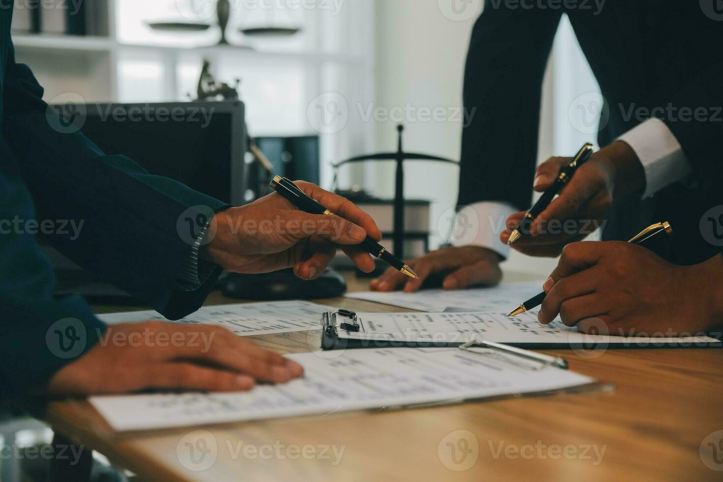 Consultation and conference of Male lawyers and professional businesswoman working and discussion having at law firm in office. Concepts of law, Judge gavel with scales of justice. photo