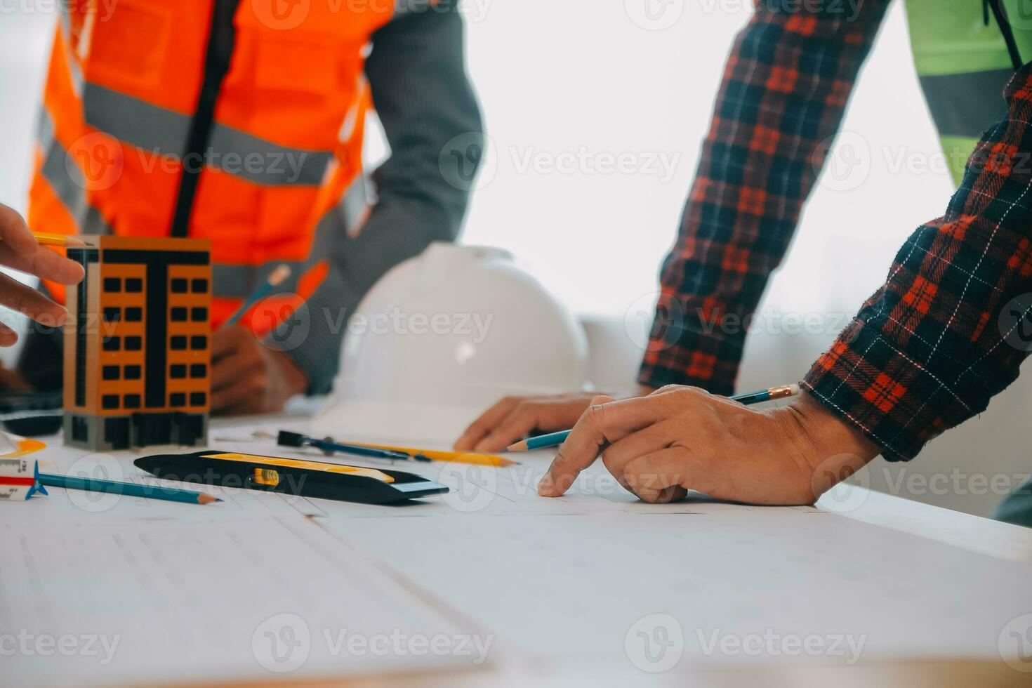 Construction and structure concept of Engineer or architect meeting for project working with partner and engineering tools on model building and blueprint in working site, contract for both companies. photo