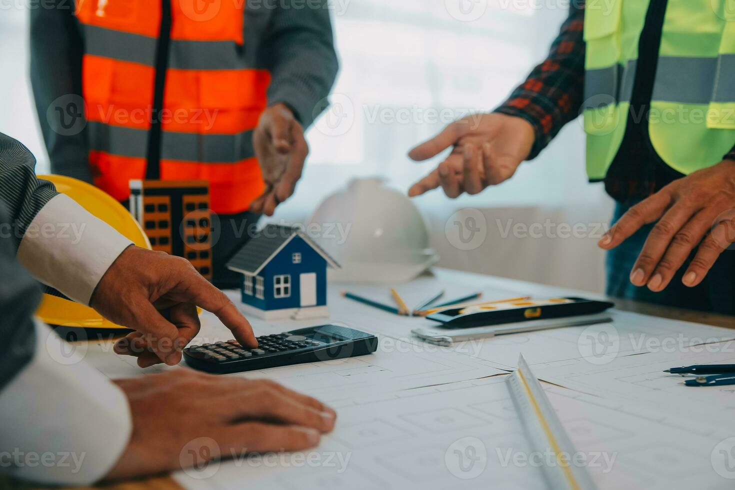 Construction and structure concept of Engineer or architect meeting for project working with partner and engineering tools on model building and blueprint in working site, contract for both companies. photo