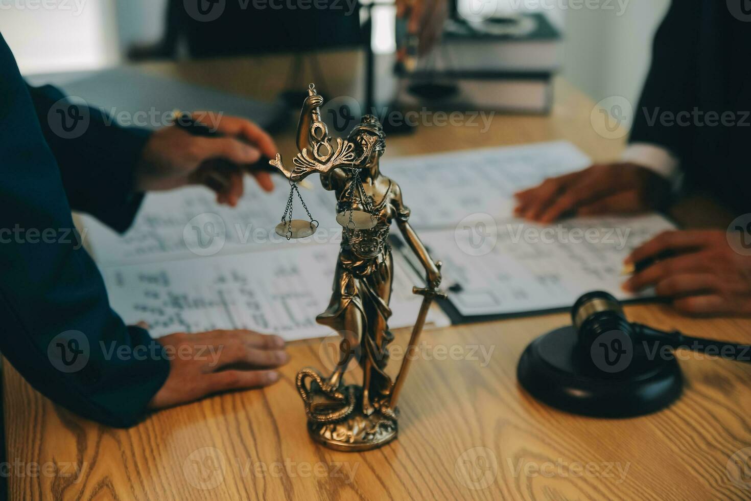 Consultation and conference of Male lawyers and professional businesswoman working and discussion having at law firm in office. Concepts of law, Judge gavel with scales of justice. photo