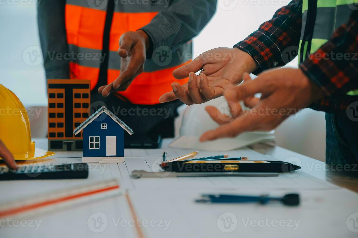 Construction and structure concept of Engineer or architect meeting for project working with partner and engineering tools on model building and blueprint in working site, contract for both companies. photo