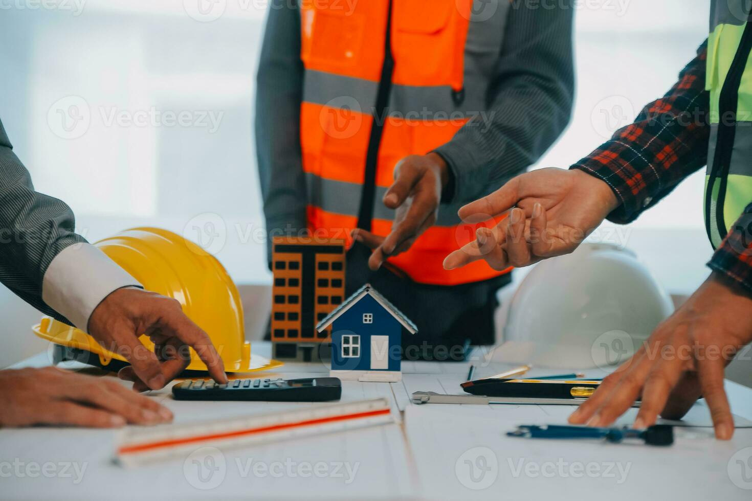 Construction and structure concept of Engineer or architect meeting for project working with partner and engineering tools on model building and blueprint in working site, contract for both companies. photo