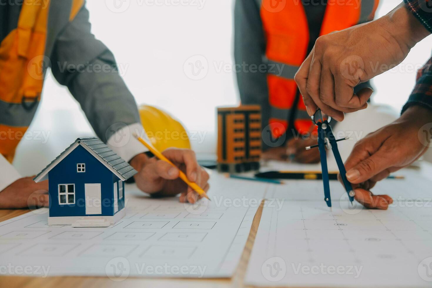 Construction and structure concept of Engineer or architect meeting for project working with partner and engineering tools on model building and blueprint in working site, contract for both companies. photo